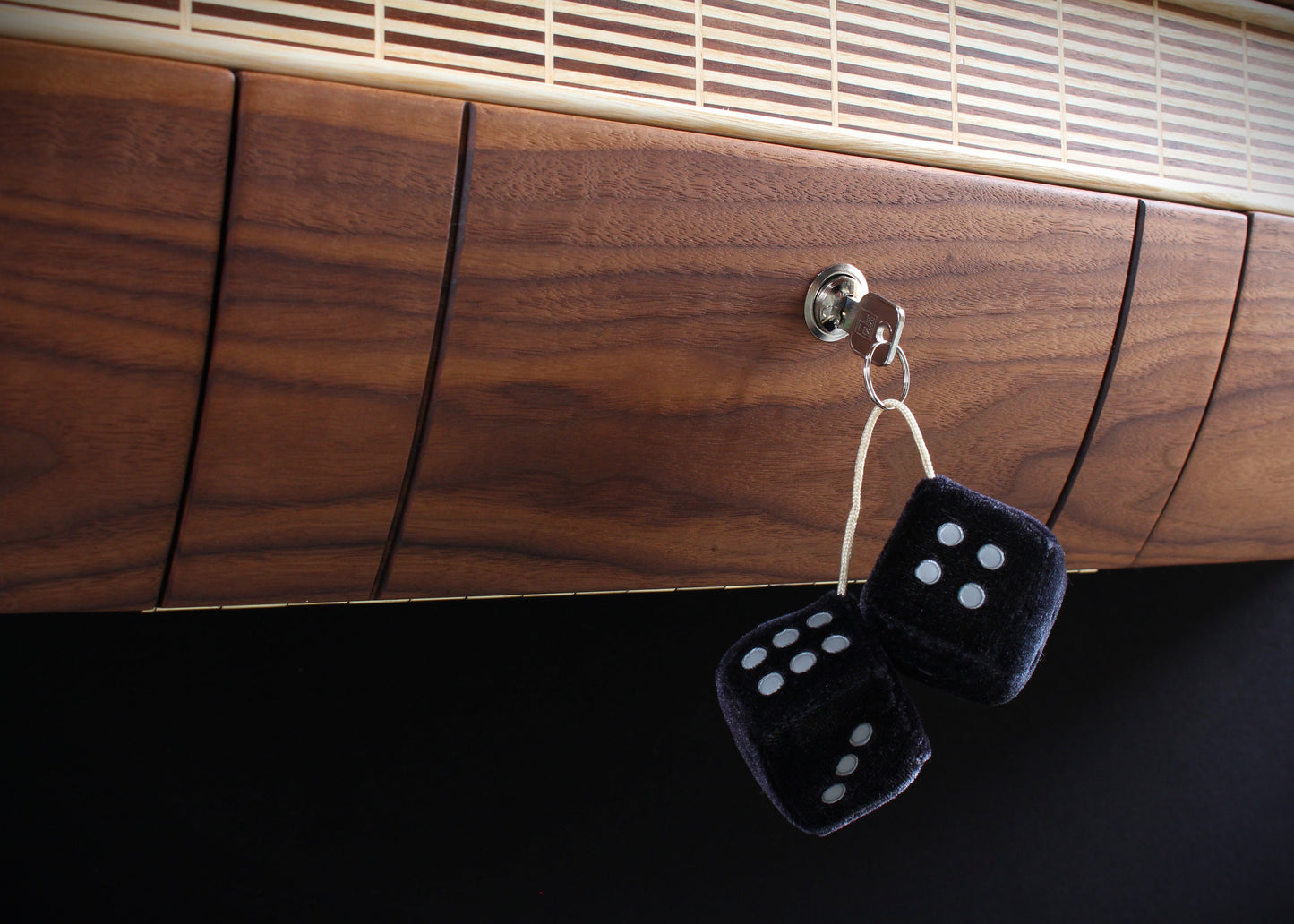 Solid wood furniture representing a Chevrolet Bel Air console, created by Stéphane Carton from Atelier Stéphane Carton, woodworker & cabinetmaker.
Limited edition of 25, 164 x 30 x 30 cm, handcrafted solid American walnut and ash structure, swamp oak veneer (fronts), oiled finish, hand application. Personalization possible.
Perfect for vintage automotive design lovers, classic cars enthusiasts and Chevrolet owners. Zoomed detailled view.