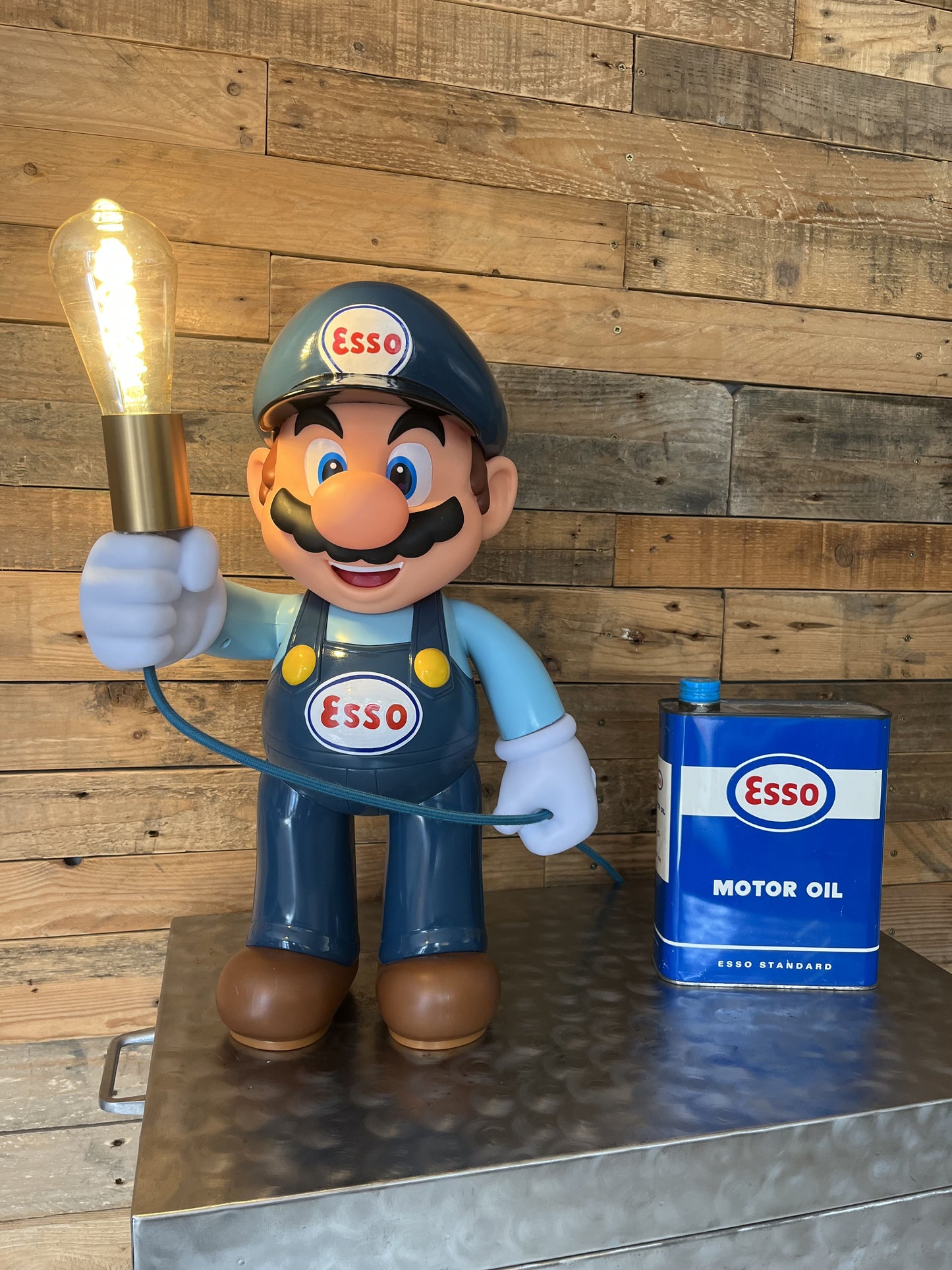 Esso blue automotive vintage lamp made from a Super Mario miniature, created by Mathieu Ollevier from Vintage Addict, limited edition of 10, 50x30 cm format. Front view showcasing the handpainted detail, a collector’s piece for automotive, vintage and gaming enthusiasts.