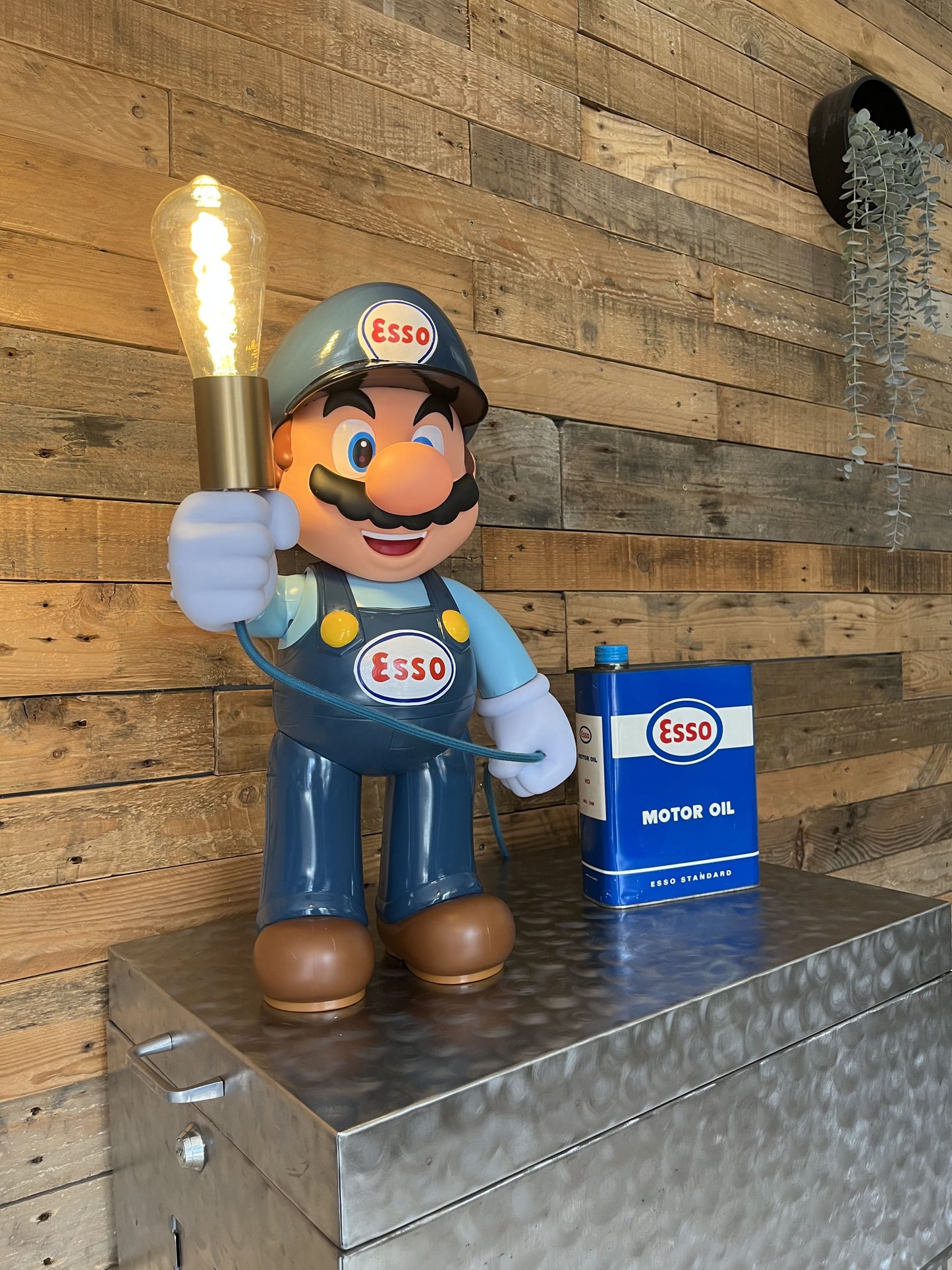 Esso blue automotive vintage lamp made from a Super Mario miniature, created by Mathieu Ollevier from Vintage Addict, limited edition of 10, 50x30 cm format. Side view showcasing the handpainted detail, a collector’s piece for automotive, vintage and gaming enthusiasts.