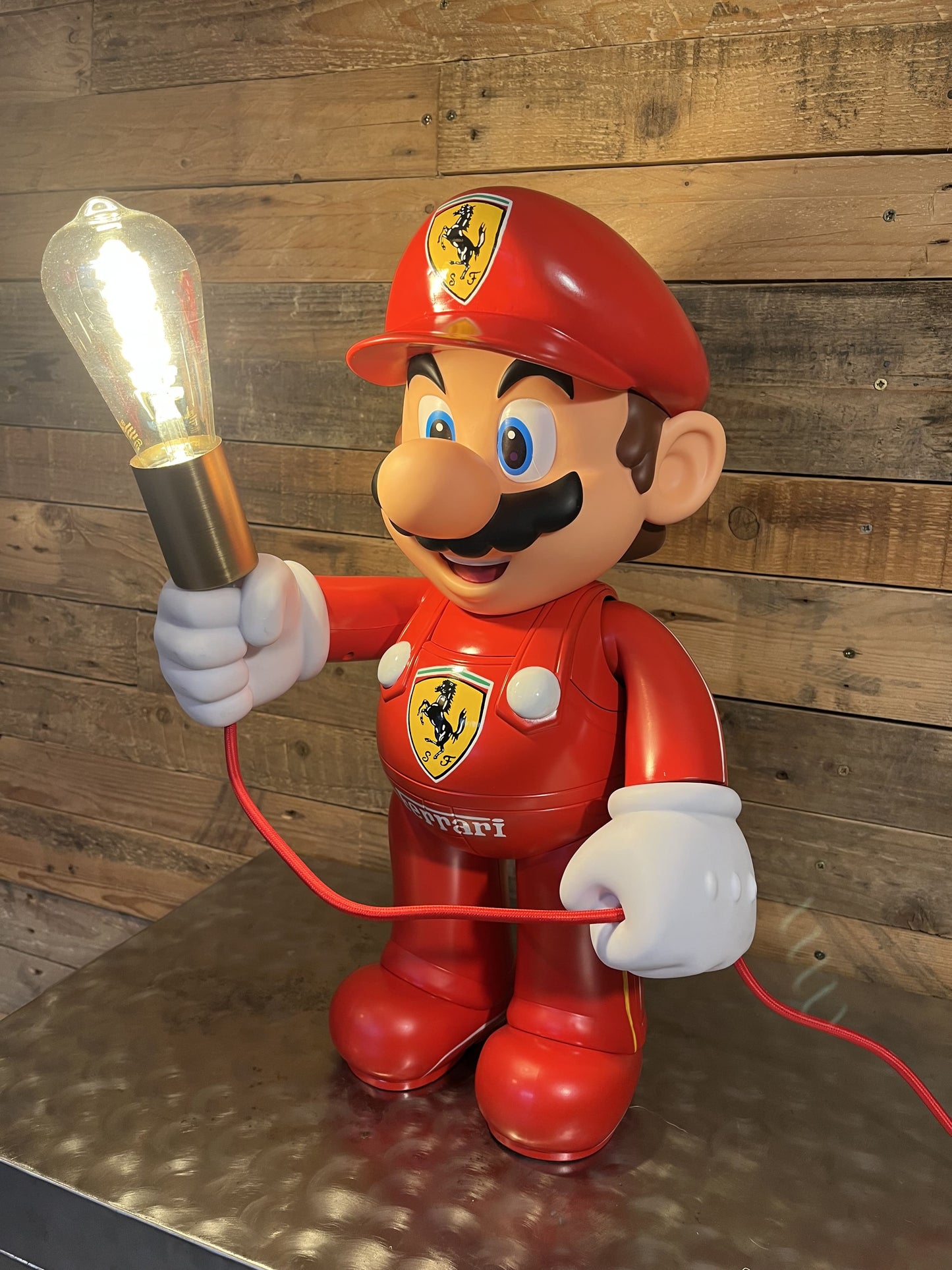 Ferrari red automotive vintage lamp made from a Super Mario miniature, created by Mathieu Ollevier from Vintage Addict, limited edition of 10, 50x30 cm format. Side view showcasing the handpainted detail, a collector’s piece for automotive, vintage and gaming enthusiasts.