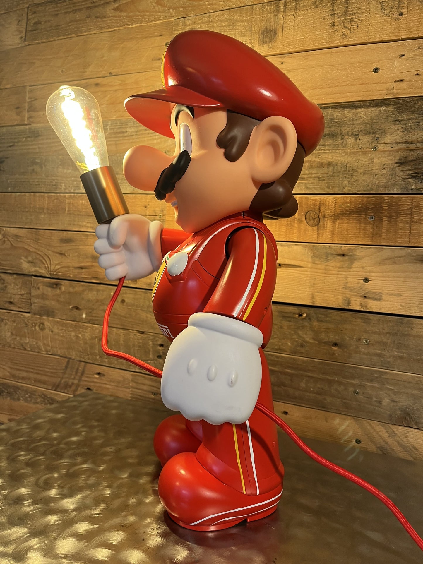 Ferrari red automotive vintage lamp made from a Super Mario miniature, created by Mathieu Ollevier from Vintage Addict, limited edition of 10, 50x30 cm format. Lateral view showcasing the handpainted detail, a collector’s piece for automotive, vintage and gaming enthusiasts.