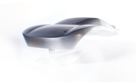 Metal sheet automotive sculpture with raw aluminium representing a Ford GT40 evocation, created by Frédéric Girard, limited edition of 8, 45x19 cm format. Nose 3/4 view showcasing the iconic curves and the meticulous attention to each sculpted detail, a collector’s piece for automotive and fine craftsmanship enthusiasts.