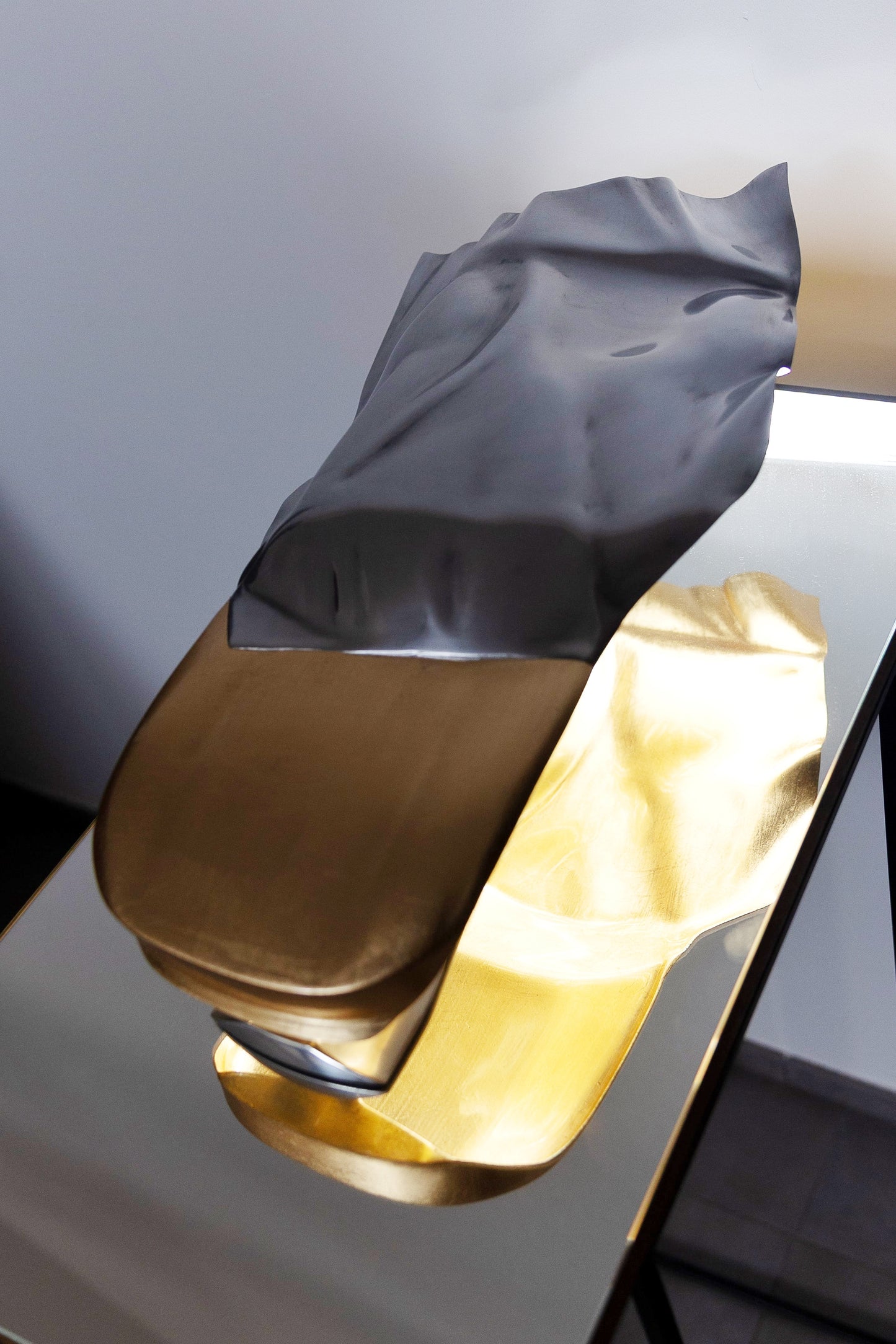 Metal sheet automotive sculpture with silver and gold finish representing GT draped, created by Frédéric Girard, limited edition of 8, 45 x 19 cm format. Top view showcasing the iconic curves and the meticulous attention to each sculpted detail, a collector’s piece for automotive and fine craftsmanship enthusiasts.