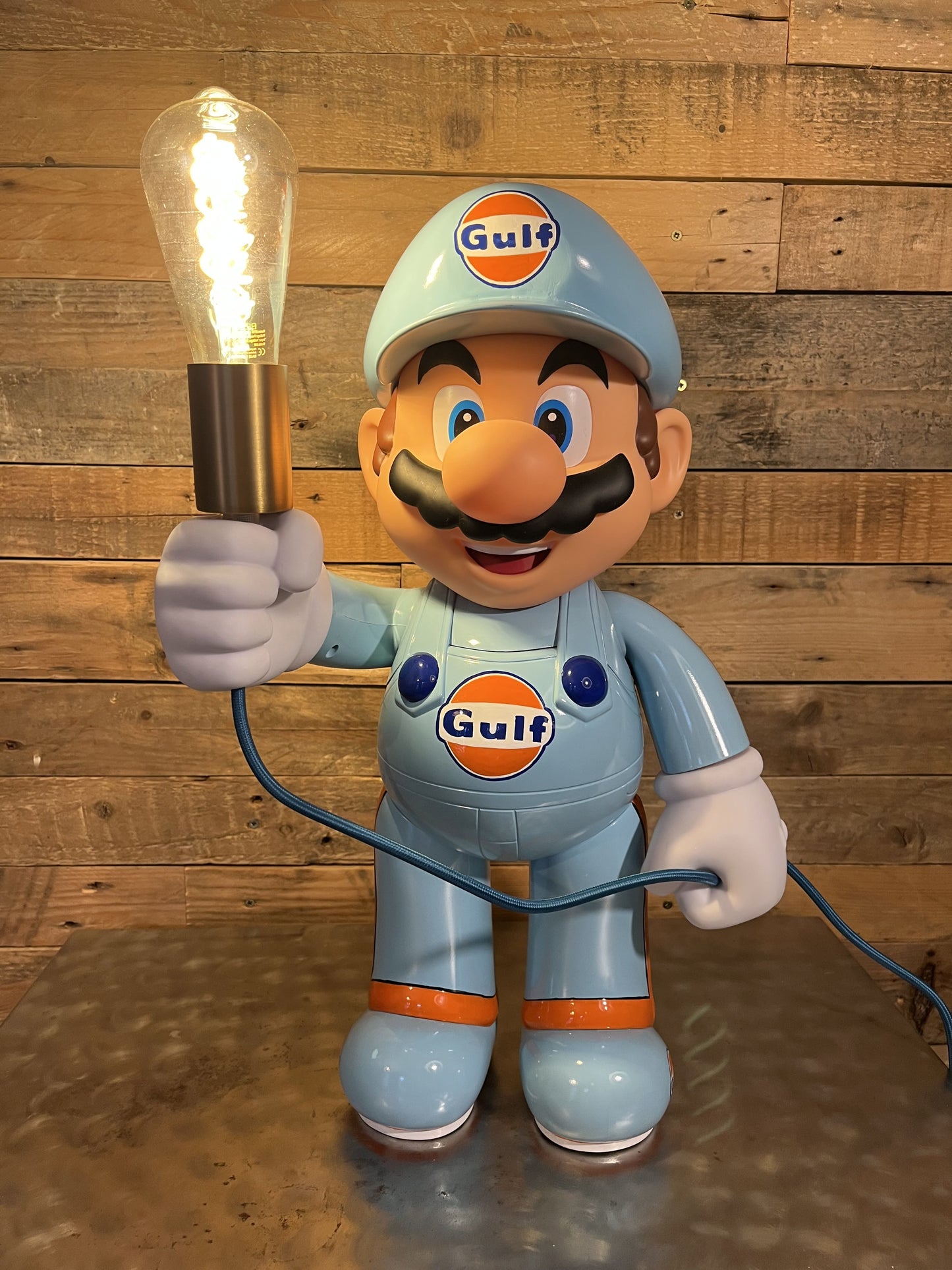 Gulf orange blue automotive vintage lamp made from a Super Mario miniature, created by Mathieu Ollevier from Vintage Addict, limited edition of 10, 50x30 cm format. Front view showcasing the handpainted detail, a collector’s piece for automotive, vintage and gaming enthusiasts.