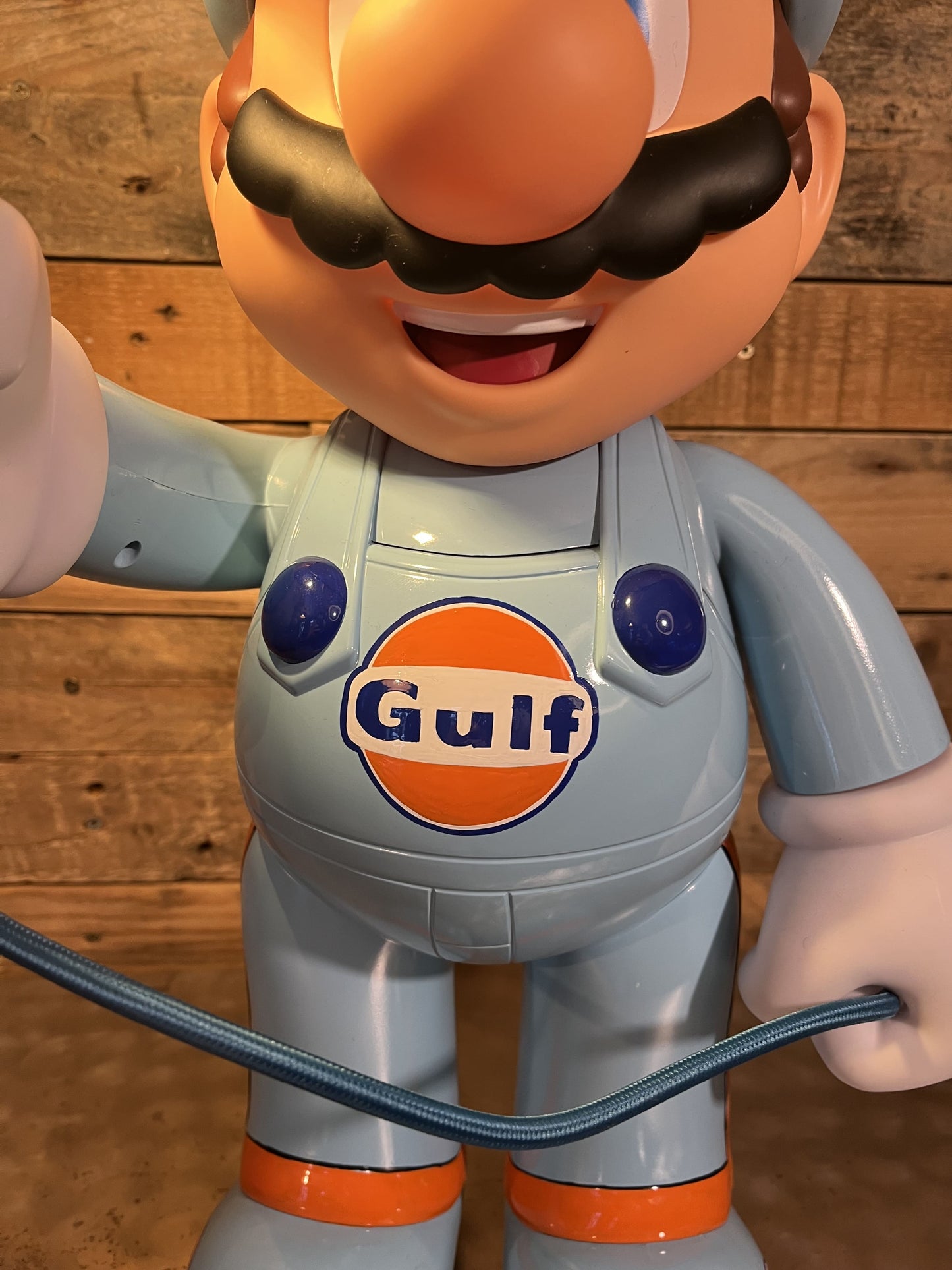Gulf orange blue automotive vintage lamp made from a Super Mario miniature, created by Mathieu Ollevier from Vintage Addict, limited edition of 10, 50x30 cm format. Logo view showcasing the handpainted detail, a collector’s piece for automotive, vintage and gaming enthusiasts.