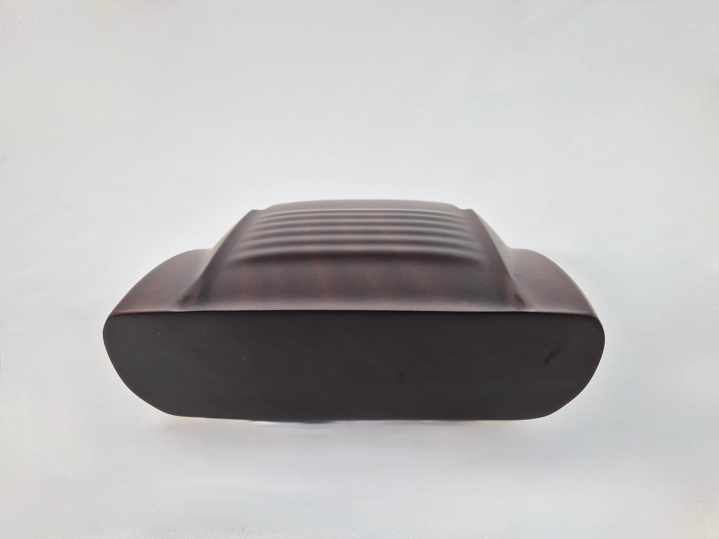 Solid mahogany sculpture with natural matte finish representing a Lamborghini Miura, created by David Voisin from Maison V&P, limited edition, 30x66 cm format. Rear view revealing the iconic rear details and the precise woodwork, a collector’s piece for automotive and fine craftsmanship enthusiasts.