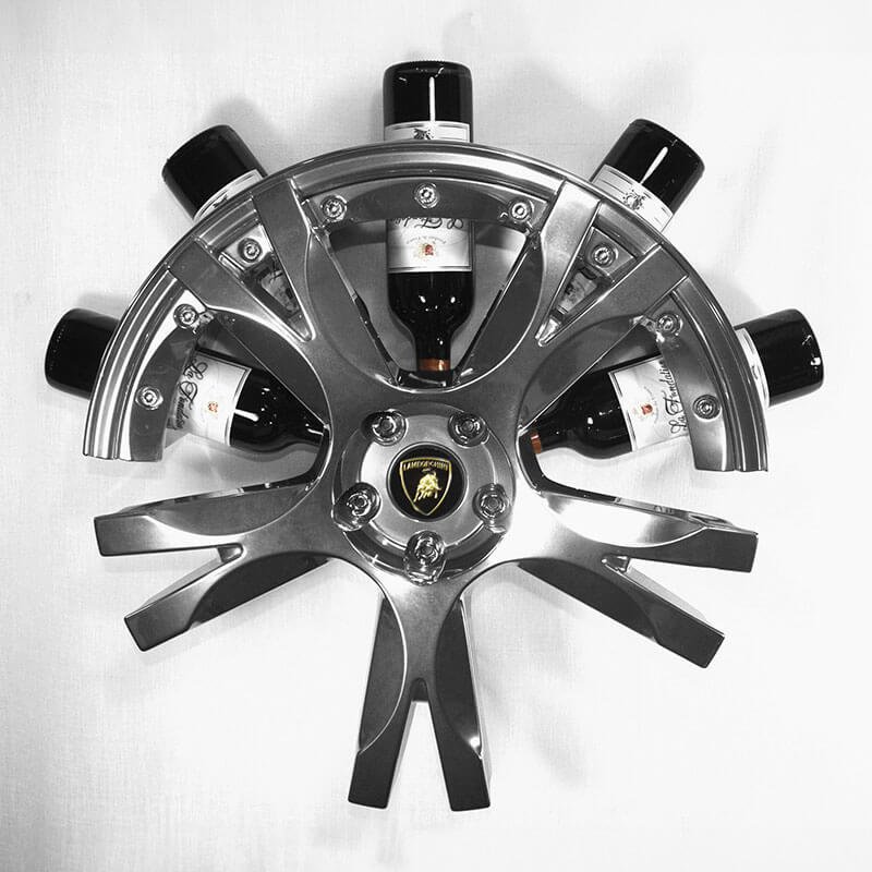 Front view of the car wheel rim bottle display stand made from a Lamborghini Gallardo wheel rim. This automotive art object measures 55x24 cm. Custom-made and handcrafted by Car2Art. Ideal for automotive art collectors. It can hold five bottles of wine or spirits.