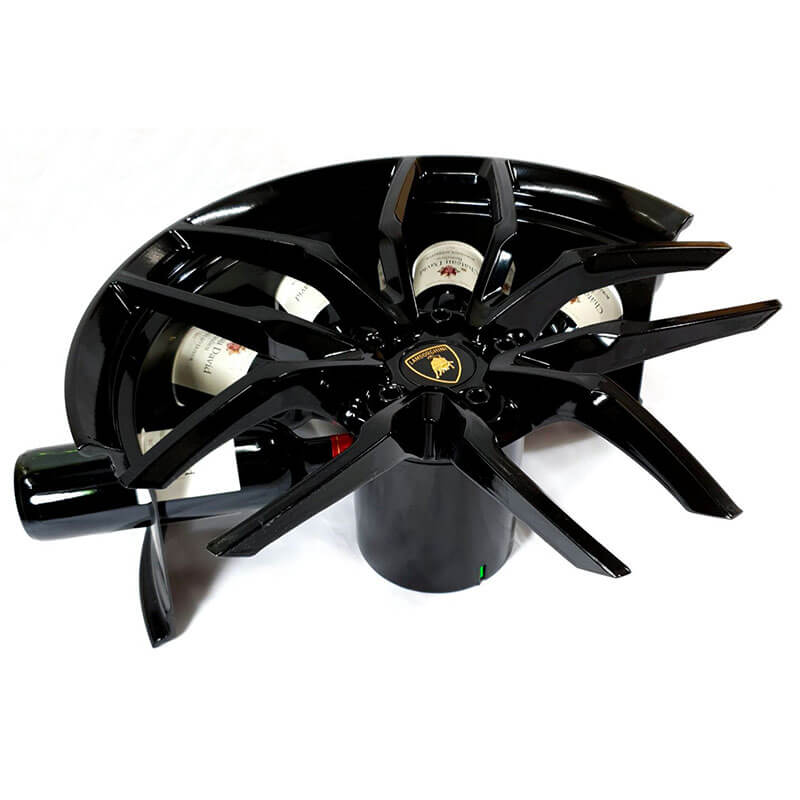 Car wheel rim bottle display stand made from a Lamborghini Huracan wheel rim. This automotive art object measures 55x24 cm. Custom-made and handcrafted by Car2Art. Ideal for automotive art collectors. It can hold five bottles of wine or spirits. Side view.