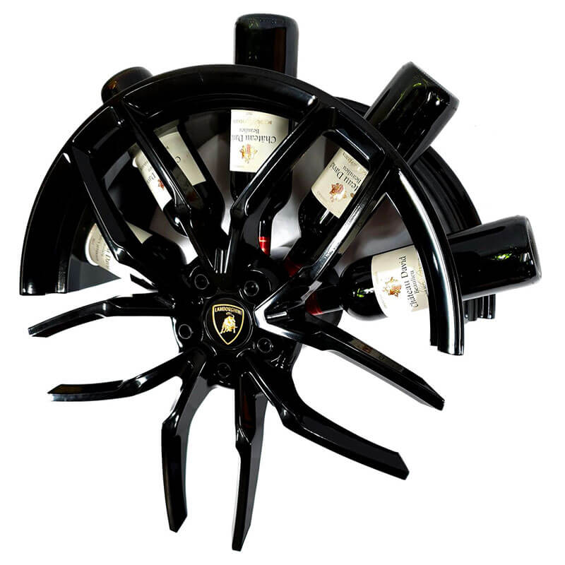 Left-side view of the car wheel rim bottle display stand made from a Lamborghini Huracan wheel rim. This automotive art object measures 55x24 cm. Custom-made and handcrafted by Car2Art. Ideal for automotive art collectors. It can hold five bottles of wine or spirits.