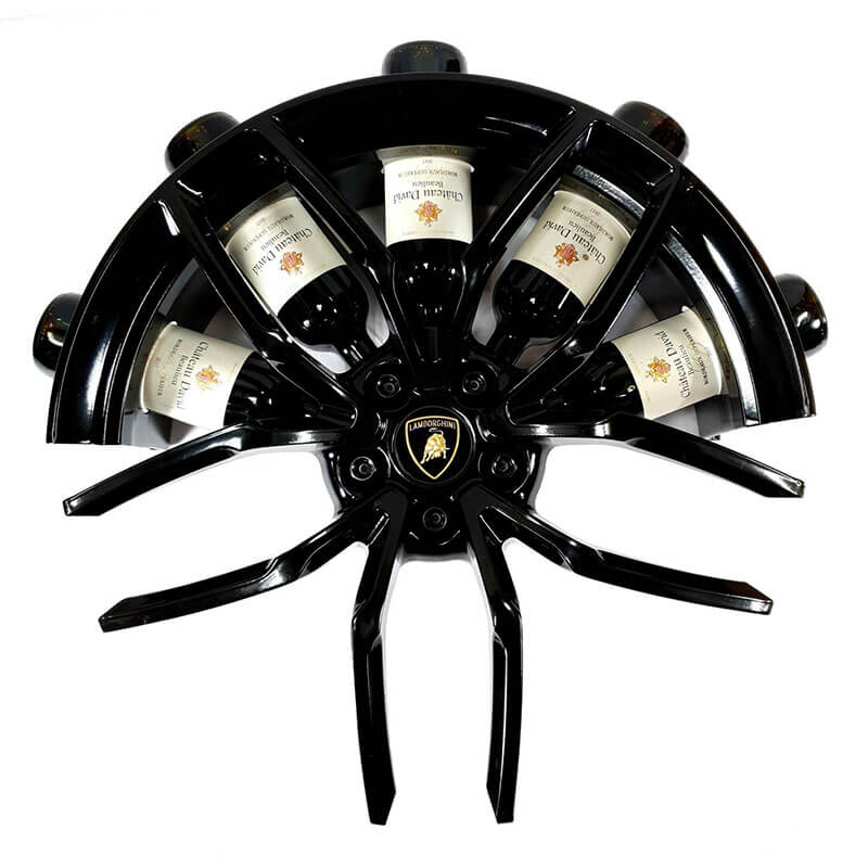 Front view of the car wheel rim bottle display stand made from a Lamborghini Huracan wheel rim. This automotive art object measures 55x24 cm. Custom-made and handcrafted by Car2Art. Ideal for automotive art collectors. It can hold five bottles of wine or spirits.