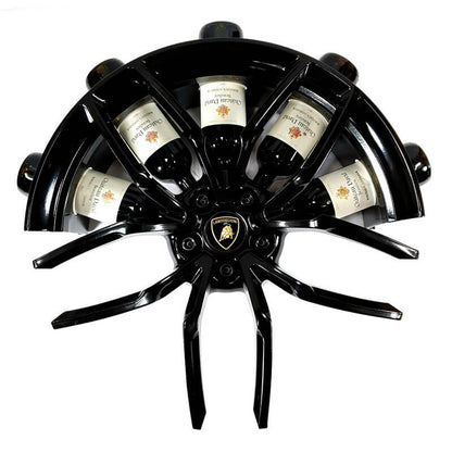 Front view of the car wheel rim bottle display stand made from a Lamborghini Huracan wheel rim. This automotive art object measures 55x24 cm. Custom-made and handcrafted by Car2Art. Ideal for automotive art collectors. It can hold five bottles of wine or spirits.