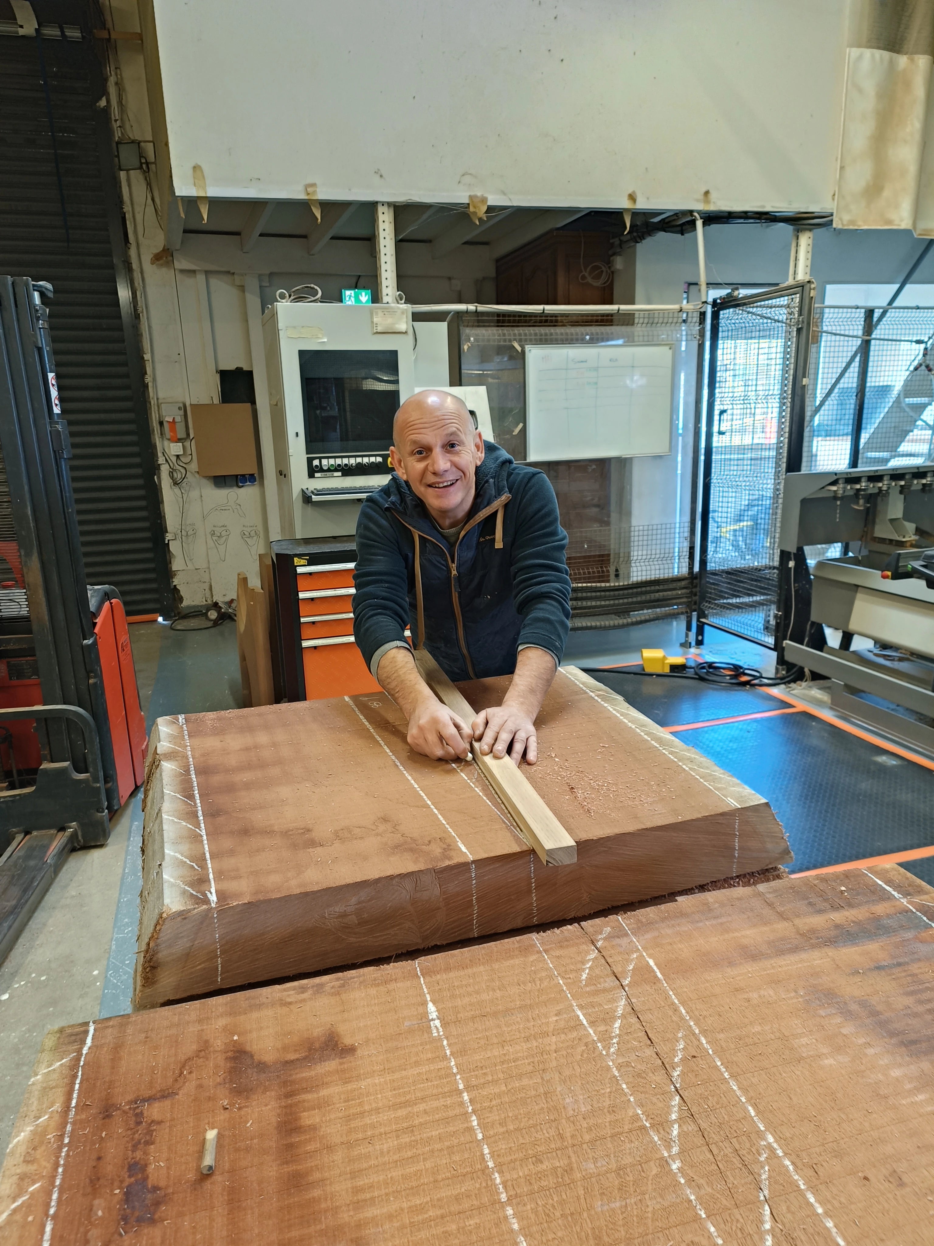 David Voisin (Maison V & P) in his workshop cutting mahogany wood in order to create automotive objets d'art