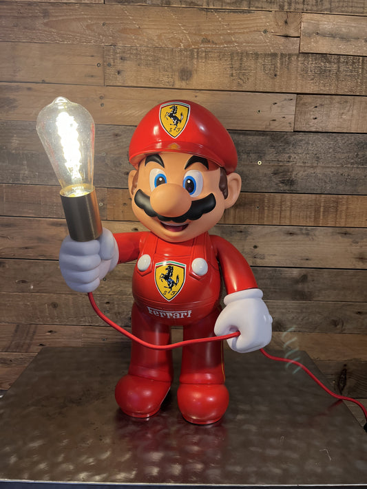 Ferrari automotive vintage lamp made from a Super Mario miniature, created by Mathieu Ollevier from Vintage Addict, limited edition of 10, 50x30 cm format. Front view showcasing the handpainted detail, a collector’s piece for automotive, vintage and gaming enthusiasts.
