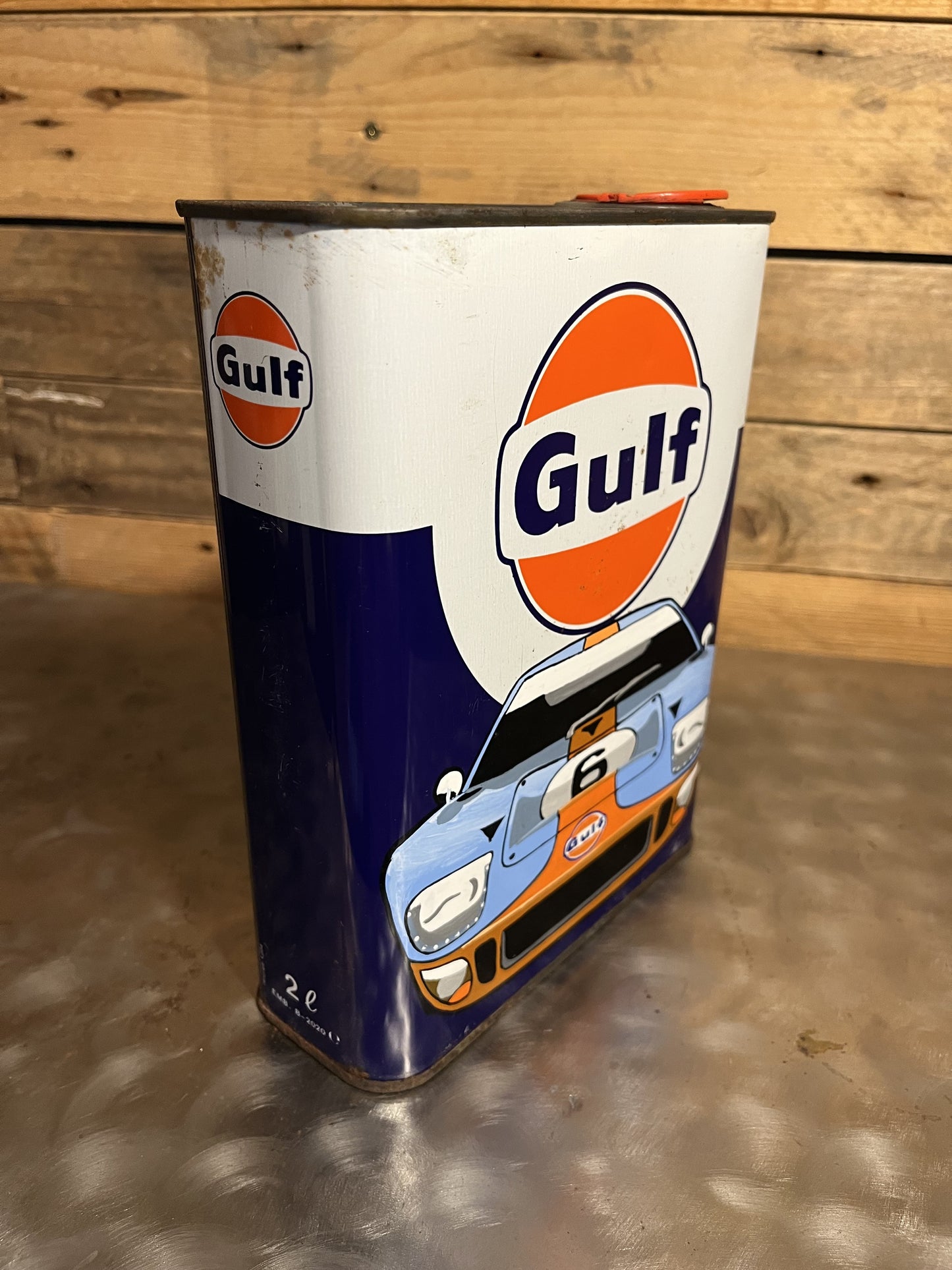 Ford GT 40 Gulf hand-painted custom vintage automotive vintage automotive oil can, created by Mathieu Ollevier from Vintage Addict, limited edition of 10, 23x17 cm format. Right view showcasing the handpainted detail, a collector’s piece for automotive, vintage and art enthusiasts.
