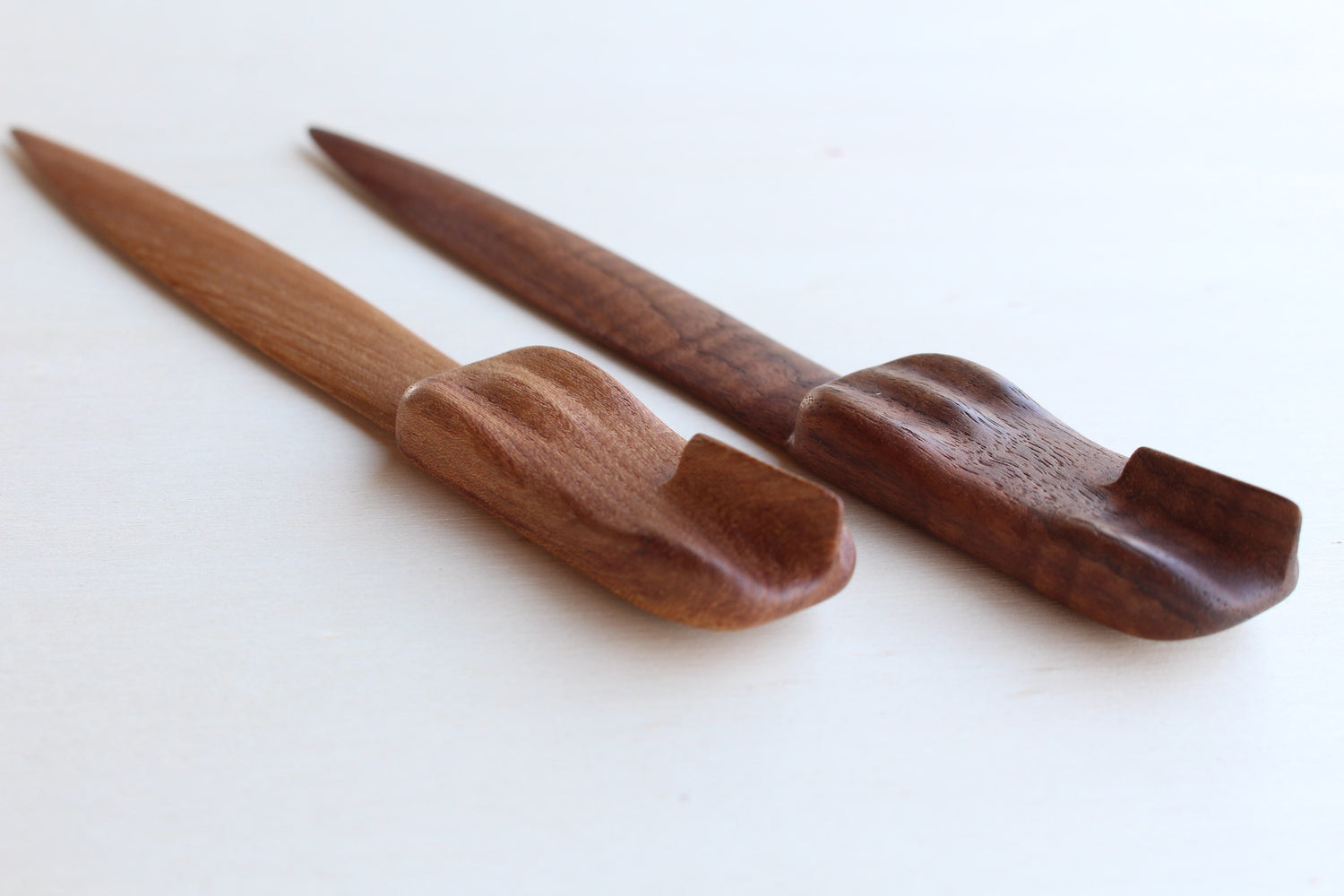 Solid wood desk decoration representing a Jaguar D-Type letter opener, created by Stéphane Carton from Atelier Stéphane Carton, woodworker & cabinetmaker.

American oak or Elm, chocolate, red or cognac leather case. Personalization possible.

Perfect for vintage automotive tool desk lovers, classic cars enthusiasts and Jaguar owners. Top view with 2 exemplaries.