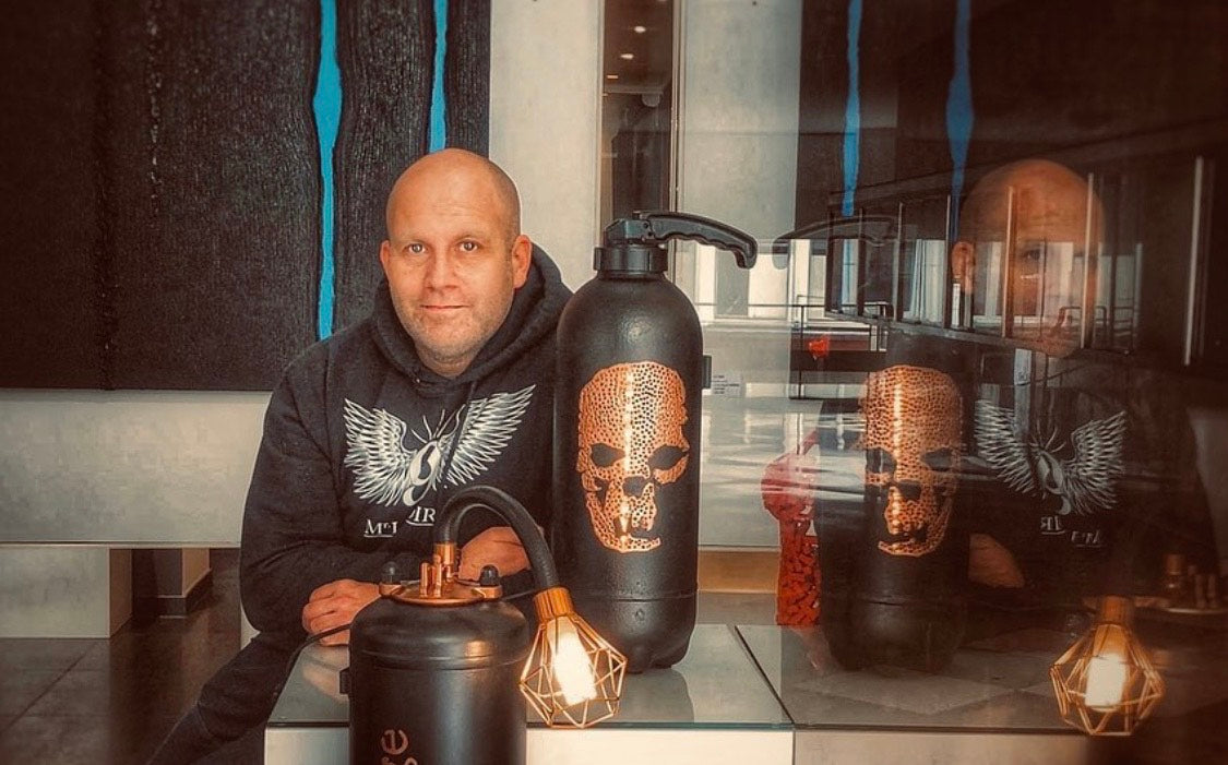 Jean Luc Rossier, creator of swiss JLR Concept in front of his automotive extinguisher lamps