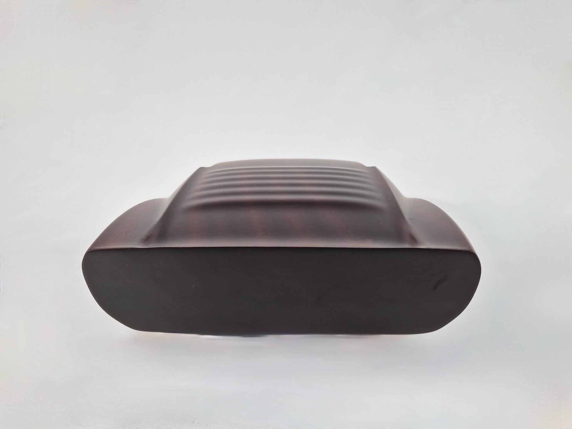 Solid mahogany sculpture with natural matte finish representing a Lamborghini Miura, created by David Voisin from Maison V&P, limited edition, 30x66 cm format. Rear view revealing the iconic rear details and the precise woodwork, a collector’s piece for automotive and fine craftsmanship enthusiasts.