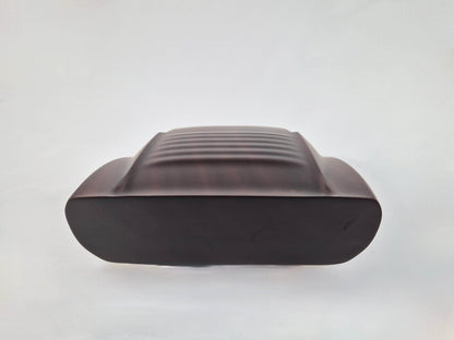 Solid mahogany sculpture with natural matte finish representing a Lamborghini Miura, created by David Voisin from Maison V&P, limited edition, 30x66 cm format. Rear view revealing the iconic rear details and the precise woodwork, a collector’s piece for automotive and fine craftsmanship enthusiasts.