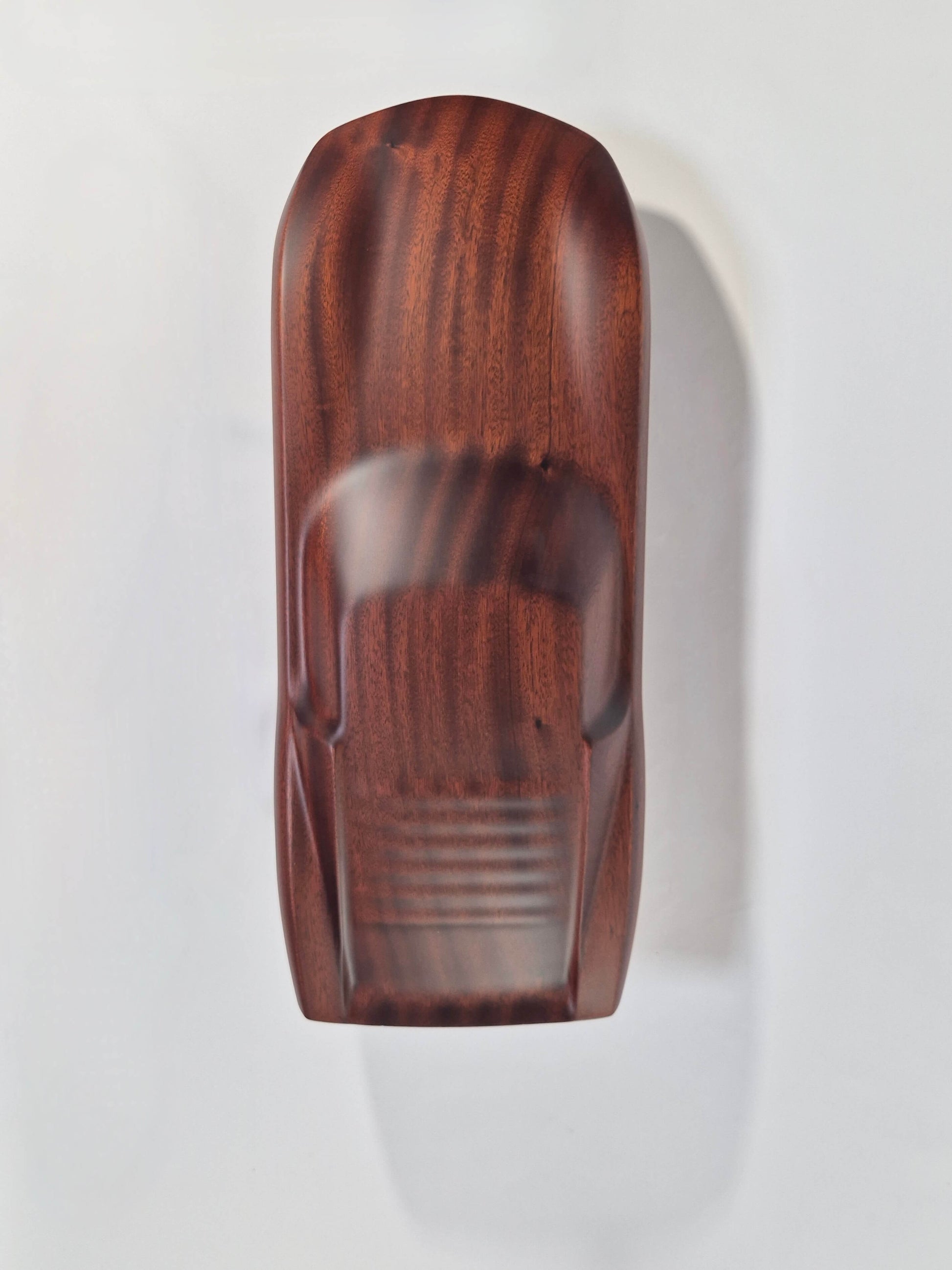 Solid mahogany sculpture with natural matte finish representing a Lamborghini Miura, created by David Voisin from Maison V&P, limited edition, 30x66 cm format. Top view revealing the elegance of the lines and the fluidity of the silhouette of this legendary supercar, a collector’s piece for automotive and fine craftsmanship enthusiasts.