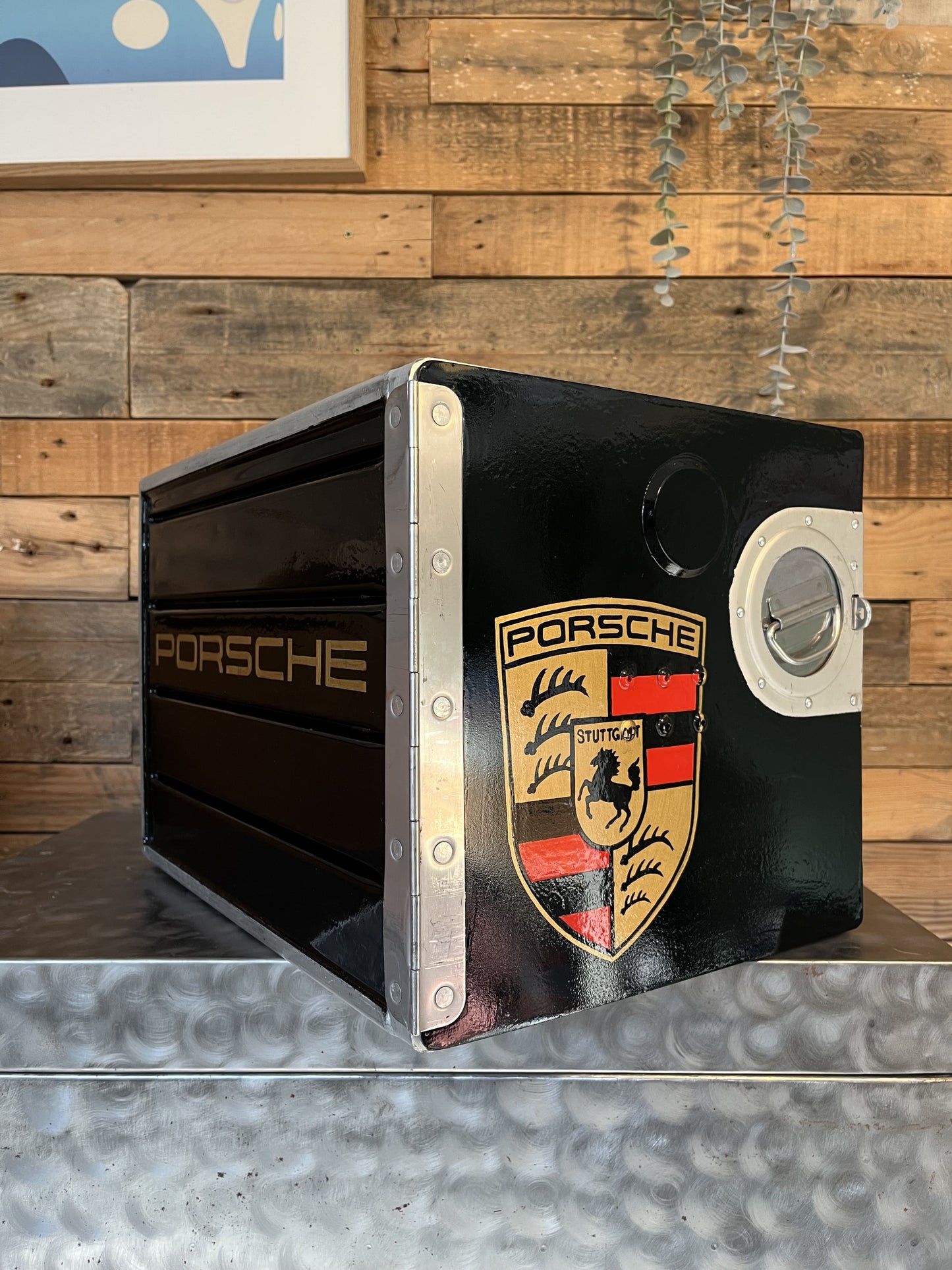 Porsche black custom automotive galley box, created by Mathieu Ollevier from Vintage Addict, limited edition of 8, 40x28x28 cm format. Front view showcasing the handpainted detail, a collector’s piece for automotive, vintage and aviation enthusiasts.