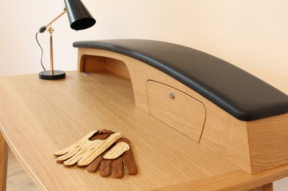 Solid wood furniture representing a Porsche 356 Secretary, created by Stéphane Carton from Atelier Stéphane Carton, woodworker & cabinetmaker.

Limited edition of 25, 130 x 65 x 94 cm, solid oak. Personalization possible.

Perfect for vintage automotive design lovers, classic cars enthusiasts and Porsche 356 owners. Top view.