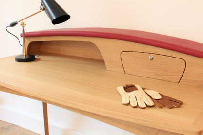 Solid wood furniture representing a Porsche 356 Secretary, created by Stéphane Carton from Atelier Stéphane Carton, woodworker & cabinetmaker.

Limited edition of 25, 130 x 65 x 94 cm, solid oak. Personalization possible.

Perfect for vintage automotive design lovers, classic cars enthusiasts and Porsche 356 owners. Zoom view.